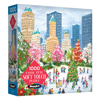 The ROSEART Soft Touch New York Christmas 1000-piece jigsaw puzzle features a festive city park scene with ice skaters, a Christmas tree, and buildings—perfect for celebrating the magic of a New York holiday.