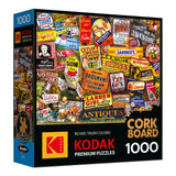 Box of a 1000-piece ROSEART - KODAK CORK - ANTIQUE SIGNS jigsaw puzzle, featuring nostalgic vintage advertising and antique sign imagery, perfect for fans of Kodak cork designs.