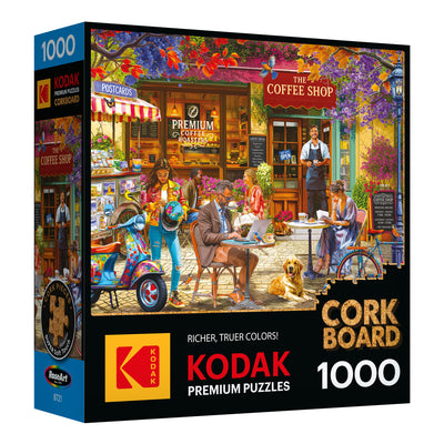 ROSEART - KODAK CORK - THE COFFEE SHOP 1000 Piece Jigsaw Puzzle features a lively coffee shop scene with people, a dog, and outdoor seating, all in a charming café setting with a unique cork board theme.