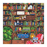 The ROSEART Hobby Haven Bookshelf 1000 Piece Jigsaw Puzzle features a vibrant home library scene with books, plants, a green typewriter, shelves, a red armchair, and the number 1000 in the lower right corner.