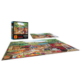 A completed ROSEART KODAK PREMIUM RED TRUCKS FARM MARKET 1000 PIECE JIGSAW PUZZLE with a vibrant market scene, plus the puzzle box and some partially assembled pieces in the background.