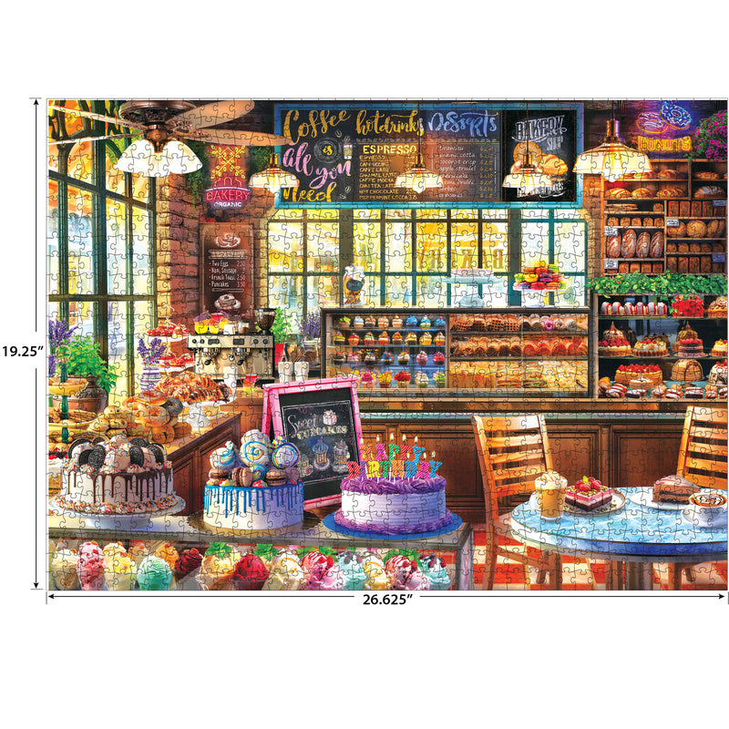Bright bakery and coffee shop scene with cakes, cupcakes, pastries, tables, chalkboard menu, and shelves. ROSEART - KODAK PREMIUM - THE BAKERY 1000 piece jigsaw puzzle—detailed interior perfect for puzzlers.