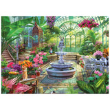 ROSEART - KODAK PREMIUM - VICTORIAN GREENHOUSE 1000 piece jigsaw puzzle: Features a lush Victorian greenhouse with flowers, central stone fountain, ornate birdcage, and white patio furniture beneath a glass ceiling. Premium quality for puzzle lovers!.