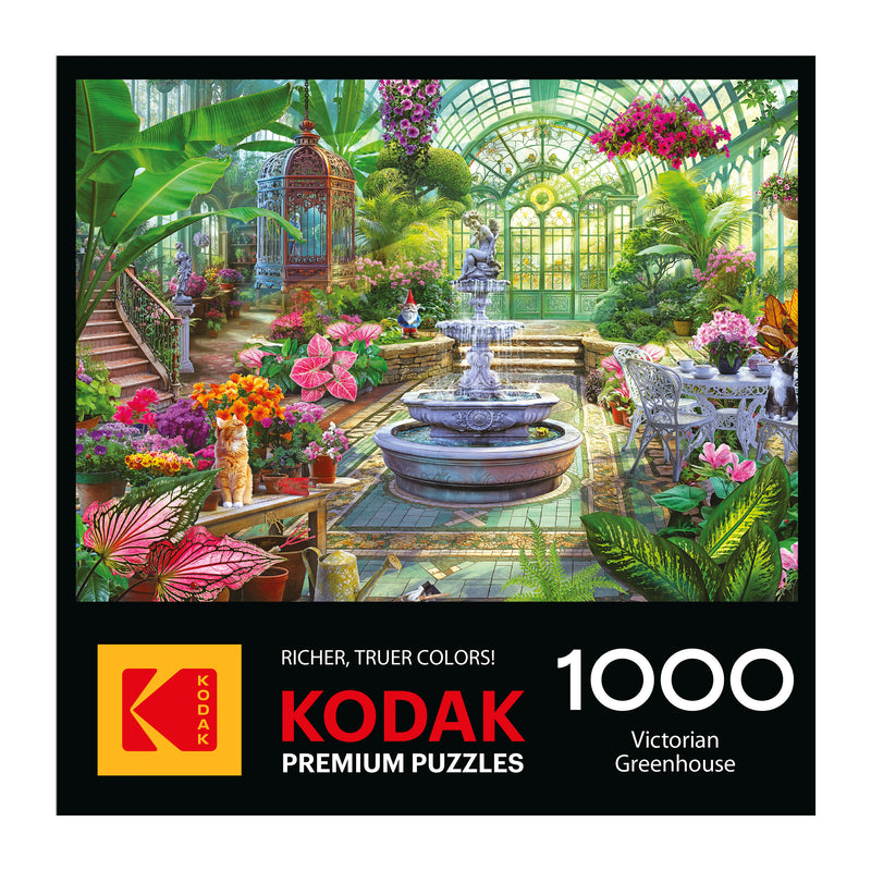 Enjoy the ROSEART - KODAK PREMIUM Victorian Greenhouse 1000 Piece Jigsaw Puzzle, featuring a lush greenhouse scene with a fountain, tropical plants, flowers, and white furniture.