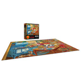 The 350-piece RoseArt KODAK Premium jigsaw puzzle, "Grandma's Kitchen," is completed on a flat surface with its box upright in the background, showcasing a colorful and intricate room filled with nostalgic charm.
