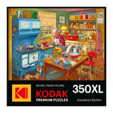 The puzzle box cover features a vintage kitchen with an elderly woman baking amid colorful dishes and a blue stove, while a cat observes. Text reads "RoseArt - KODAK Premium - Grandma's Kitchen - 350 Piece Jigsaw Puzzle.