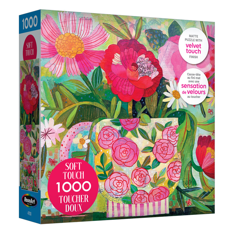 Box of ROSEART-SOFT TOUCH-CUP FULL OF ROSIE 1000 piece jigsaw puzzle featuring a floral teapot with pink and red flowers; "Soft Touch" label highlights its luxurious velvet finish.