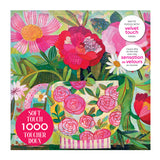 The ROSEART-SOFT TOUCH-CUP FULL OF ROSIE-1000 PIECE JIGSAW PUZZLE features a colorful floral illustration and comes in a matte, soft velvet finish box labeled "SOFT TOUCH 1000 TOUCHER DOUX.