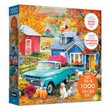 The ROSEART-SOFT TOUCH-AUTUMN HILL COTTAGE-1000 PIECE JIGSAW PUZZLE features a vibrant autumn farm scene with a blue pickup truck, dogs, pumpkins, barn, and house surrounded by colorful fall trees.