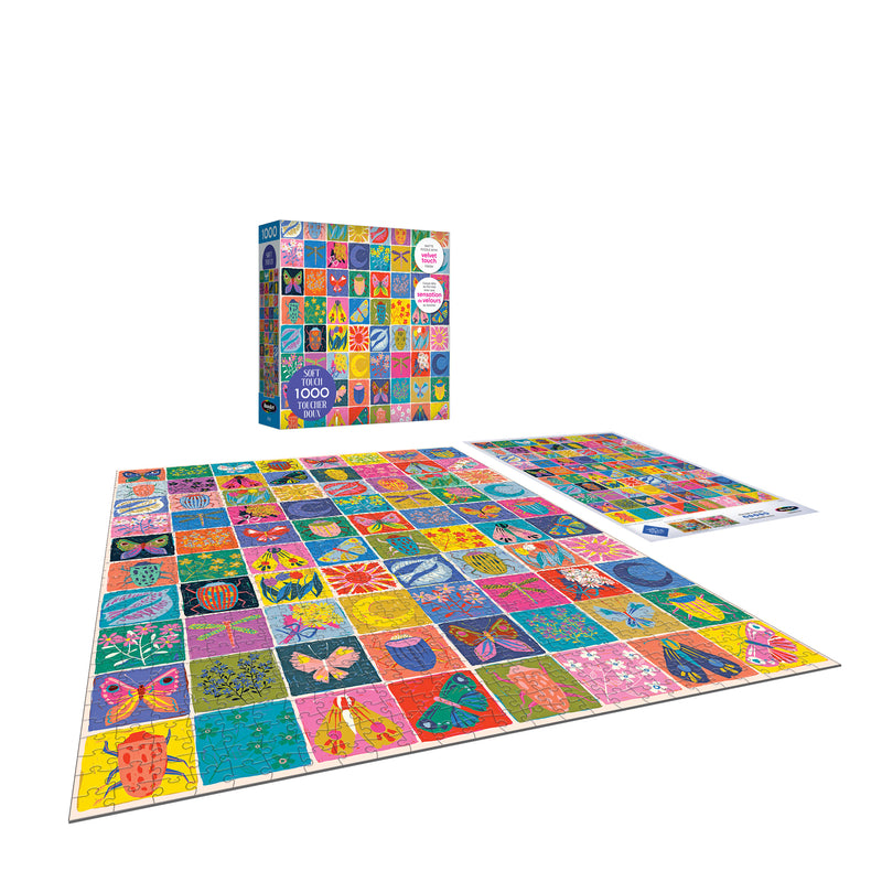 The completed ROSEART-SOFT TOUCH-SUMMER QUILT-1000 PIECE JIGSAW PUZZLE with vibrant nature-themed quilt squares is shown next to its box and reference poster on a white background.