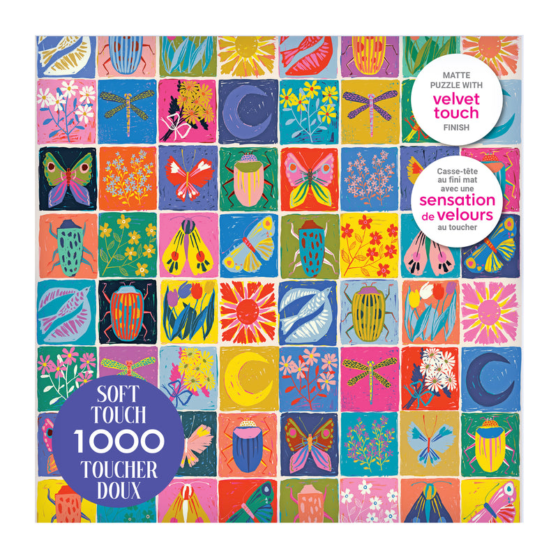 The ROSEART-SOFT TOUCH-SUMMER QUILT-1000 PIECE JIGSAW PUZZLE box displays a bright grid of flowers, insects, and moons, with “soft touch” and “velvet touch finish” noted in English and French on the packaging.