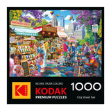 Experience the lively "CITY STREET FAIR" scene with vibrant stalls, artists, musicians, and families on the 1000-piece ROSEART-KODAK PREMIUM jigsaw puzzle.