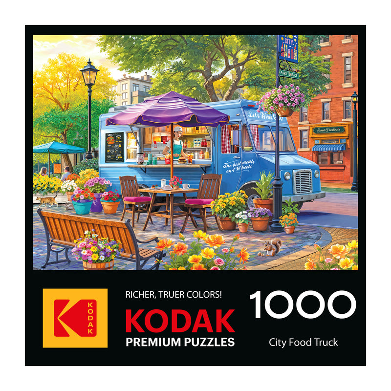 Puzzle box cover shows a colorful city park with a food truck, outdoor seating, flowers, and trees. Text: "ROSEART-KODAK PREMIUM-CITY FOOD TRUCK-1000 PIECE JIGSAW PUZZLE.