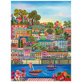 Enjoy assembling the ROSEART-MILLIE ILLUSTRATES-PORT DE SOLLER 300 piece jigsaw puzzle, featuring vibrant buildings, lush trees, flowers, sailboats on the water, and a crescent moon over this charming coastal town.