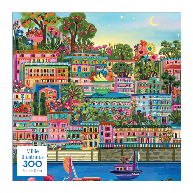 ROSEART-MILLIE ILLUSTRATES-PORT DE SOLLER-300 PIECE JIGSAW PUZZLE features a colorful painting of Port de Soller, a Mediterranean town with vibrant buildings, lush greenery, and boats on the water beneath a blue sky.
