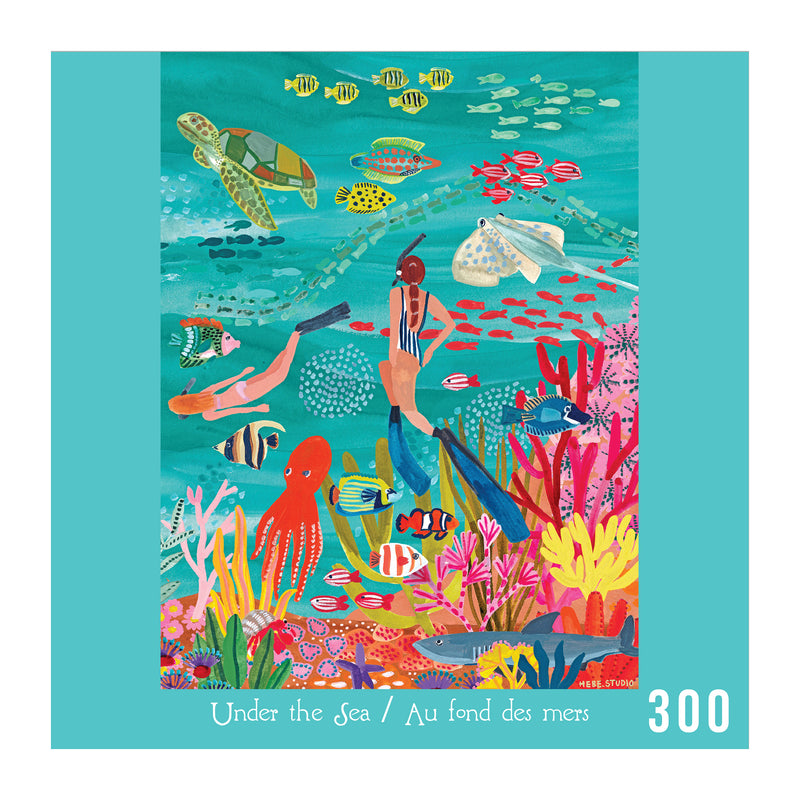 The ROSEART-HEBE STUDIOS-UNDER THE SEA 300 PIECE JIGSAW PUZZLE shows two snorkelers with fish, sea creatures, and coral reefs. Includes "Under the Sea / Au fond des mers" and "300" text on the colorful illustrated scene.