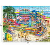 The ROSEART-BIGELOW ILLUSTRATIONS-SHAGGY'S SURF SHACK-500 PIECE JIGSAW PUZZLE features a vibrant beachside scene with surfboards, bicycle, merchandise, and tropical decor against a blue ocean and sky. Finished size: 18" x 24".