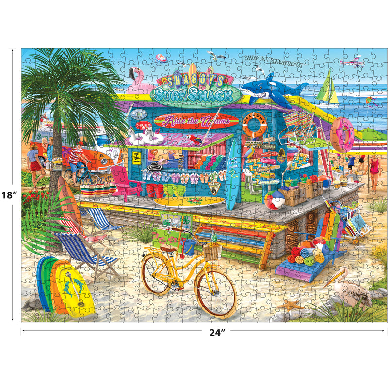 The ROSEART-BIGELOW ILLUSTRATIONS-SHAGGY'S SURF SHACK-500 PIECE JIGSAW PUZZLE features a vibrant beachside scene with surfboards, bicycle, merchandise, and tropical decor against a blue ocean and sky. Finished size: 18" x 24".
