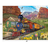 A colorful vintage steam train travels through red rock canyons in the ROSEART-BIGELOW ILLUSTRATIONS-CANYON EXPRESS 500 piece jigsaw puzzle, measuring 18 x 24 inches.
