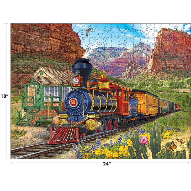 A colorful vintage steam train travels through red rock canyons in the ROSEART-BIGELOW ILLUSTRATIONS-CANYON EXPRESS 500 piece jigsaw puzzle, measuring 18 x 24 inches.