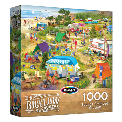 The ROSEART-BIGELOW COUNTRY-SEASIDE CRAMPED GROUNDS 1000 piece jigsaw puzzle features a lively seaside campground scene with people, tents, RVs, and beach activities.
