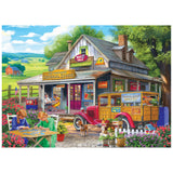 Experience country charm with the ROSEART-BIGELOW COUNTRY-GENERAL GOODS-1000 PIECE JIGSAW PUZZLE, featuring a vintage general store, people, red car, dog, flowers, and a scenic countryside under a blue sky.