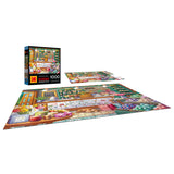 The ROSEART-KODAK PREMIUM-SOAP & CANDLE SHOP 1000 piece jigsaw puzzle displays a vivid shop scene, shown both completed and in progress, with the Kodak-branded box visible in the background.
