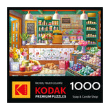 The ROSEART-KODAK PREMIUM-SOAP & CANDLE SHOP 1000 piece jigsaw puzzle features an illustrated shop scene with vibrant soaps, flowers, and candles throughout the store.