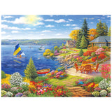 Experience the beauty of lakeshore living with the ROSEART-KODAK PREMIUM 350 piece jigsaw puzzle, featuring a sailboat, dock, vibrant flowers, patio chairs, and cozy houses amid trees under a bright, cloud-dappled sky.