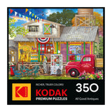 The ROSEART-KODAK PREMIUM "ALL GOOD ANTIQUES" 350 piece jigsaw puzzle box shows a colorful antique shop scene with a red vintage truck.