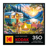 The ROSEART-KODAK PREMIUM Sunset Camper with Golden Retriever 350 Piece Jigsaw Puzzle features a lakeside campsite at sunset with a camper, campfire, picnic tables, and golden retriever—perfect for relaxing puzzle nights.