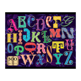 The ROSEART-ALPHABET PUZZLE 500 piece jigsaw features ornate, colorful capital letters on a dark purple background with a "500 Foil Puzzle" label in the lower left corner.