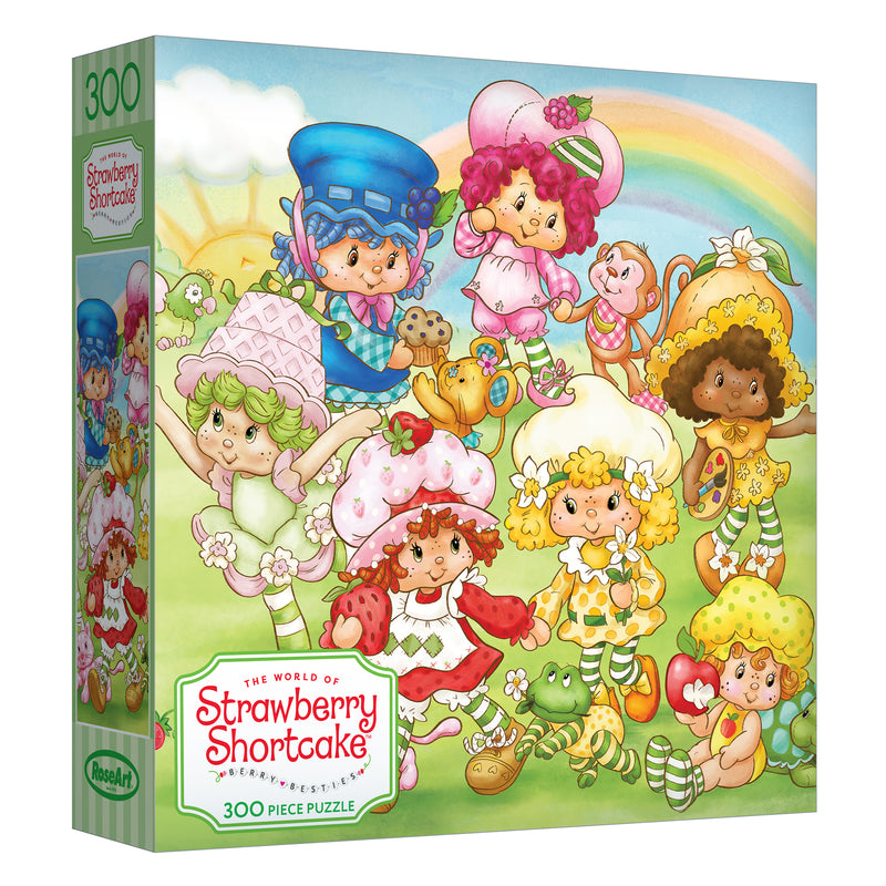 The ROSEART-STRAWBERRY SHORTCAKE-BERRY BESTIES 300-piece jigsaw puzzle showcases Strawberry Shortcake cartoon characters in a lively garden scene filled with flowers, tea sets, and rainbows.