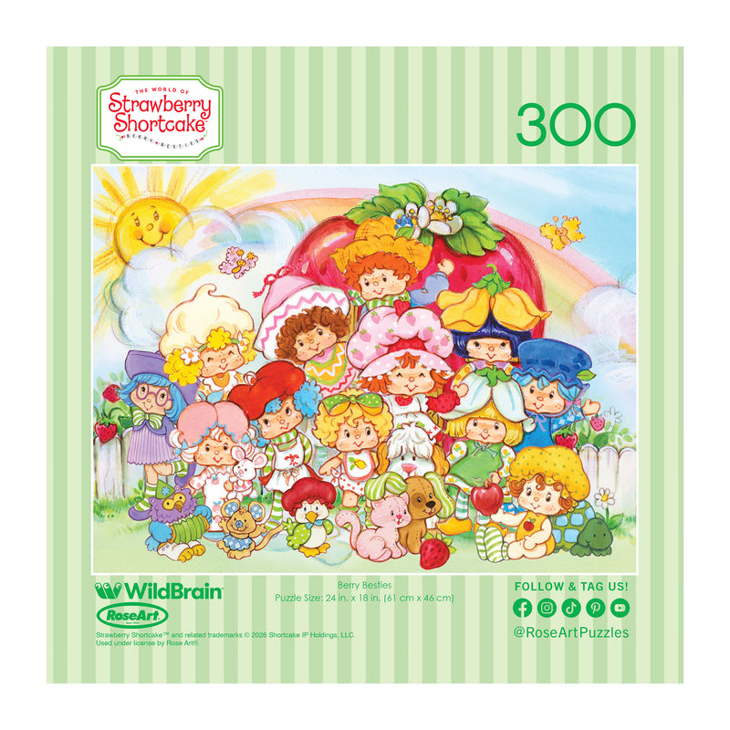 The ROSEART-STRAWBERRY SHORTCAKE-BERRY BESTIES 300 piece jigsaw puzzle features colorful cartoon characters and animals in front of a big strawberry house, surrounded by greenery and flowers.