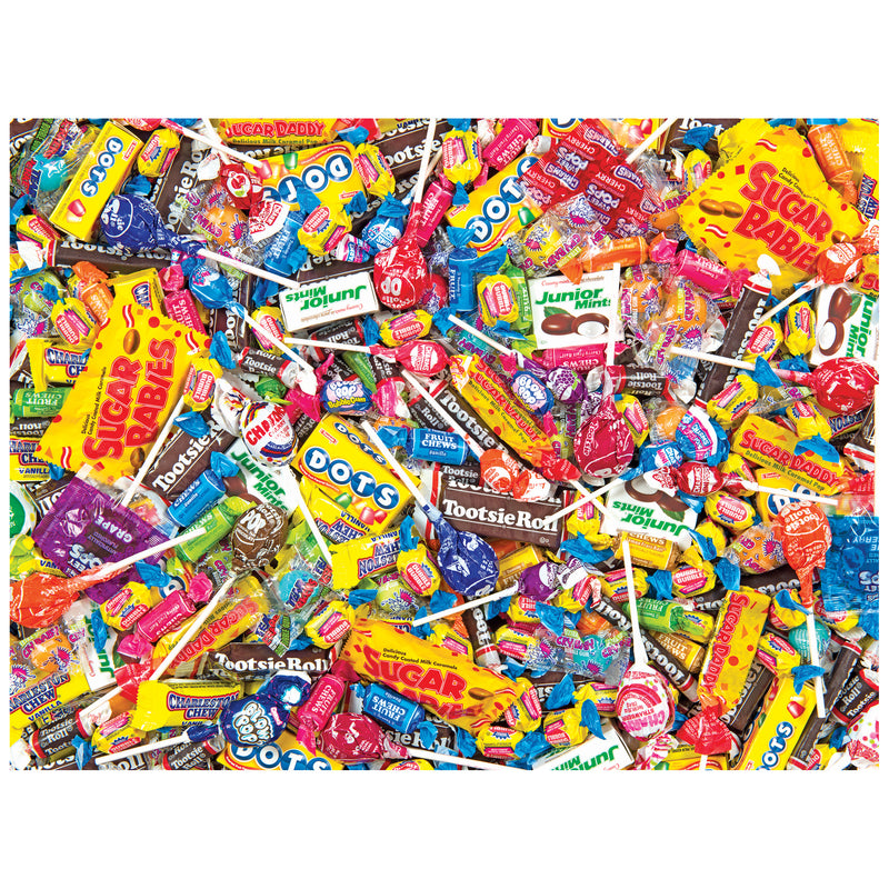 A 500-piece jigsaw puzzle featuring a vibrant pile of lollipops, Tootsie Rolls, Sugar Daddies, Dots, and other candies from the ROSEART SNACK ASSORTMENT TOOTSIE MEGA MIX.