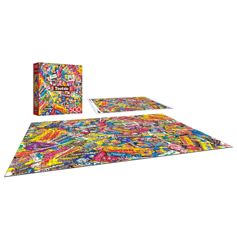 The ROSEART-SNACK ASSORTMENT-TOOTSIE MEGA MIX 500-piece jigsaw puzzle showcases vibrant TOOTSIE candy wrappers and comes complete with a matching box—perfect for puzzle and snack enthusiasts alike.