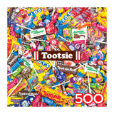 The ROSEART SNACK ASSORTMENT TOOTSIE MEGA MIX 500 Piece Jigsaw Puzzle features assorted Tootsie candies, including lollipops, Tootsie Rolls, Junior Mints, and Dots, showcased in a vibrant square collage design.