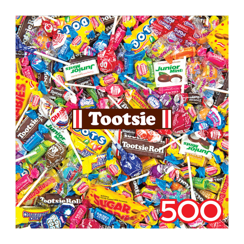 The ROSEART SNACK ASSORTMENT TOOTSIE MEGA MIX 500 Piece Jigsaw Puzzle features assorted Tootsie candies, including lollipops, Tootsie Rolls, Junior Mints, and Dots, showcased in a vibrant square collage design.