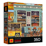Front of ROSEART-KODAK PREMIUM-THE DAILY GRIND 350 piece jigsaw puzzle box featuring an illustrated coffee shop scene with outdoor seating, menu boards, and a food cart.