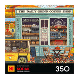 Illustration of a coffee shop with outdoor seating, a food truck, and fall decor featured on the ROSEART-KODAK PREMIUM THE DAILY GRIND 350 piece jigsaw puzzle.