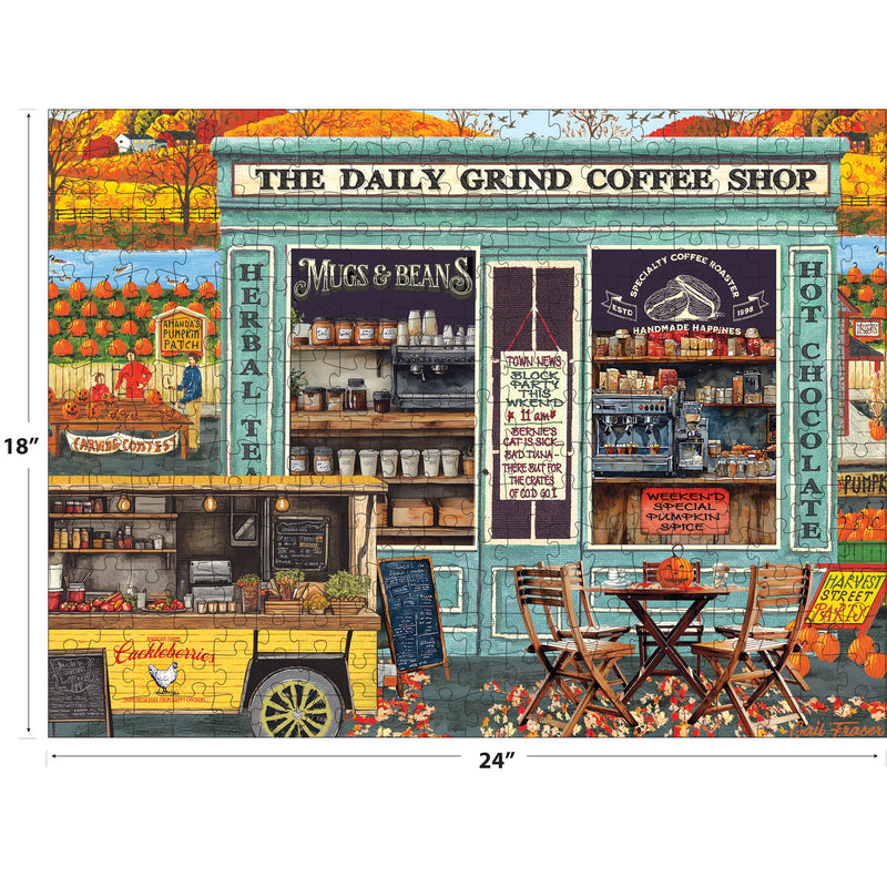 The ROSEART-KODAK PREMIUM-THE DAILY GRIND 350 piece jigsaw puzzle features a vibrant coffee shop exterior with mugs, coffee items, autumn décor, and outdoor tables. Crafted on KODAK premium board. Finished size: 18" x 24".