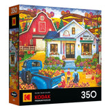 The ROSEART-KODAK PREMIUM Junior's Farmer's Market 350-piece jigsaw puzzle features a vibrant fall farm stand scene with apples, a red barn, blue truck, people, and colorful autumn scenery.