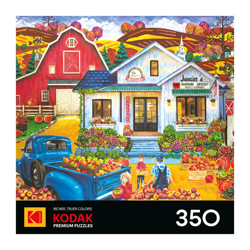 The ROSEART KODAK Premium Junior's Farmer's Market 350-piece jigsaw puzzle features a vibrant rural autumn scene with a barn, people, blue truck, and baskets of apples.