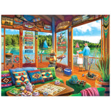 A cozy lakeside cabin with colorful decor, a board game on the table, and an elderly couple overlooking sailboats—just like the ROSEART-KODAK PREMIUM-THE LAKE HOUSE-350 PIECE JIGSAW PUZZLE.