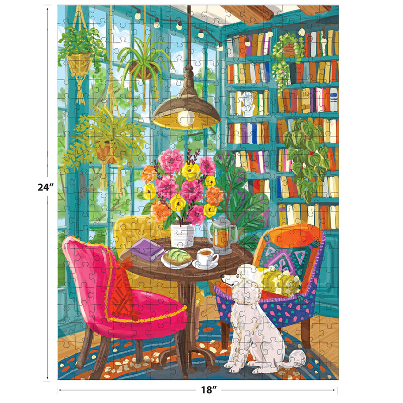 A bright room with big windows, bookshelves, plants, a flower-topped table, two chairs, and a white dog is beautifully illustrated in the ROSEART-OLIVIA GIBBS-HOME LIBRARY-300 PIECE JIGSAW PUZZLE (24" x 18").