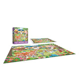 The ROSEART-OLIVIA GIBBS-EASTER GARDEN-300 PIECE JIGSAW PUZZLE, featuring a vibrant Easter garden scene, is shown completed next to its box and a reference sheet with the same colorful illustration.