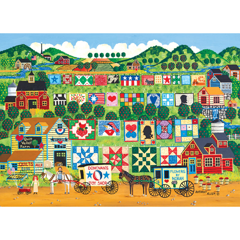 A colorful painting depicts a rural hillside filled with quilt patterns on buildings, a toy shop, a horse-drawn flower cart, and a farm named "Quilt Valley Farm." People and animals are also present. The scene is featured in the RoseArt - Home Country - Quilt Valley Farm - 1000 Piece Jigsaw Puzzle.