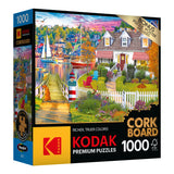 RoseArt - Kodak Cork - Charles Harbor - 1000 Piece Jigsaw Puzzle premium puzzle box showing a vibrant lakeside scene with boats, a house, and a garden. Includes 1000 pieces and a bonus puzzle poster.
