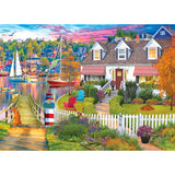 A picturesque coastal village scene with colorful houses, boats in a harbor, a dog by a picket fence, and a garden with flowers, under a vibrant sky can be found in the RoseArt - Kodak Cork - Charles Harbor - 1000 Piece Jigsaw Puzzle.