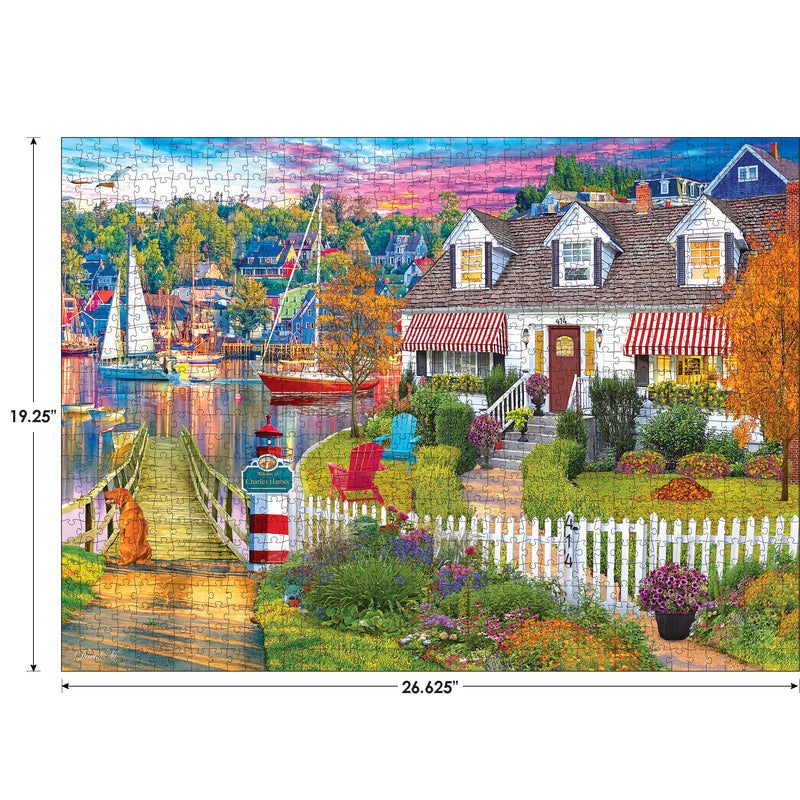 Colorful puzzle featuring a coastal village scene with boats, a house with red awnings, a picket fence, and a vibrant garden. Dimensions of the puzzle are 26.625 inches by 19.25 inches. Product Name: RoseArt - Kodak Cork - Charles Harbor - 1000 Piece Jigsaw Puzzle